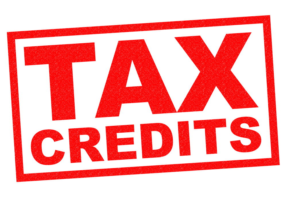 TAX CREDITS red Rubber Stamp over a white background.